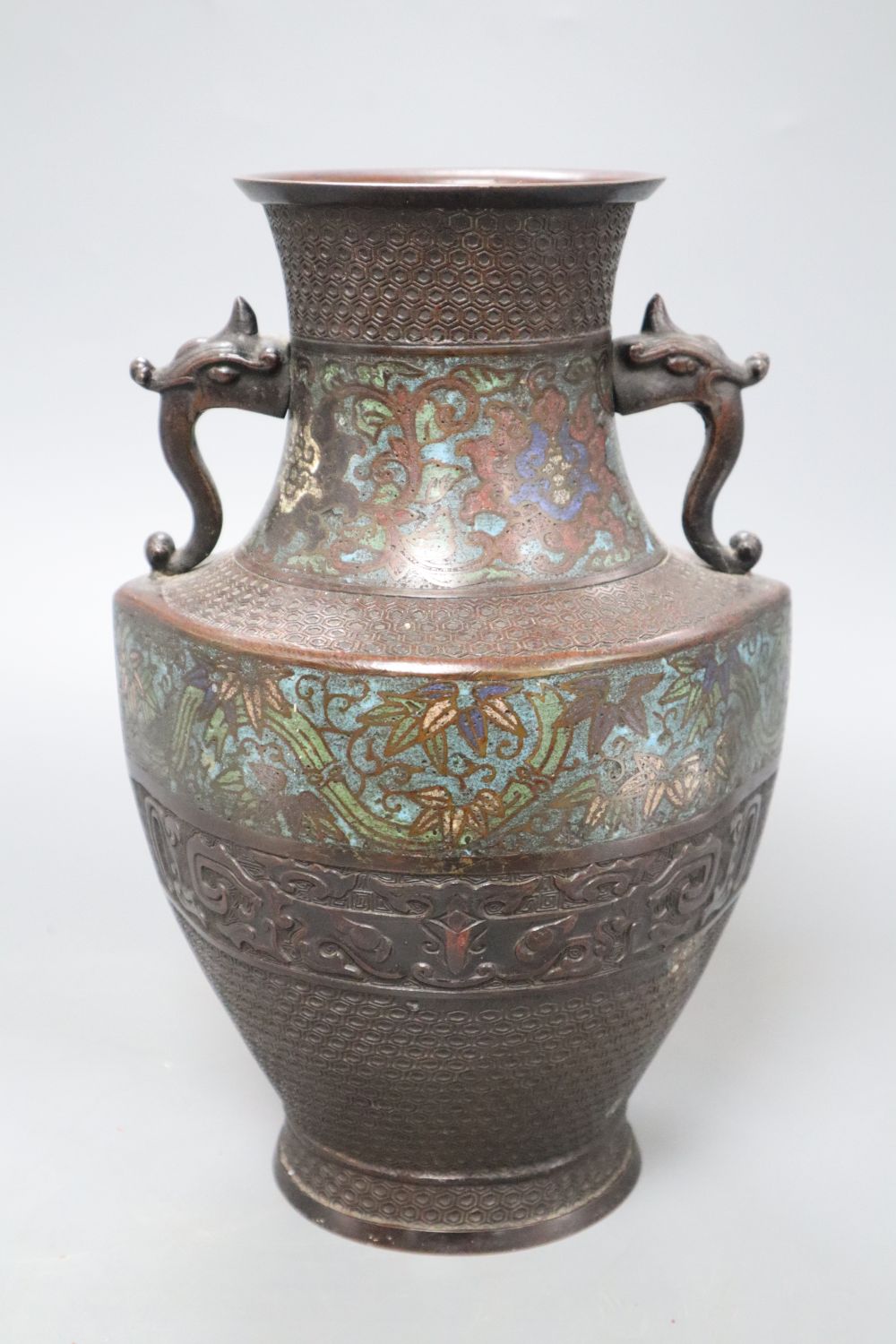 An Oriental bronze and champleve two handled vase, height 28cm